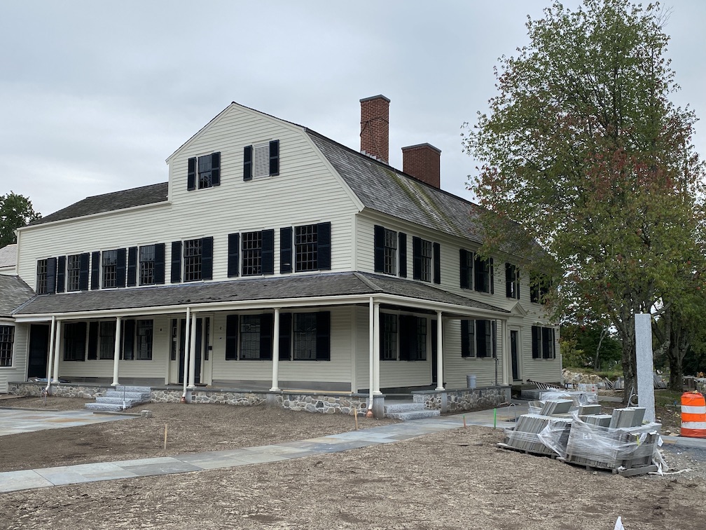 Josiah Smith Tavern under renovation, with new stone walkways being installed out front.