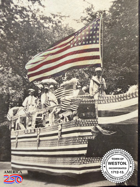 Large parade float for Weston's 200th anniversary in 1913, festooned with US flags.